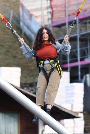 Salma Hayek - Pictured on a bungee trampoline in Gstaad