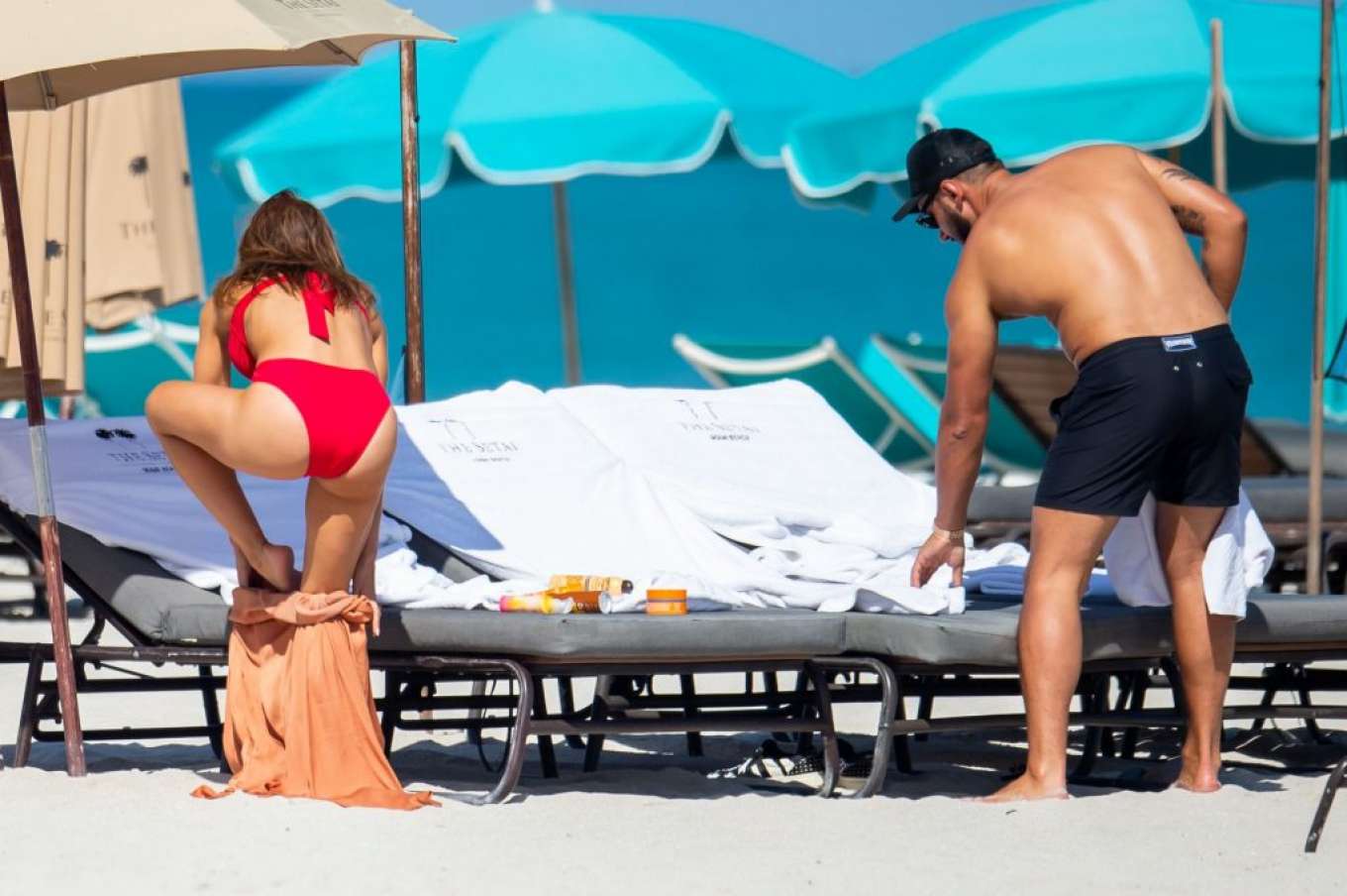 Sara Corrales in Red Bikini on the beach beach day in Miami. 