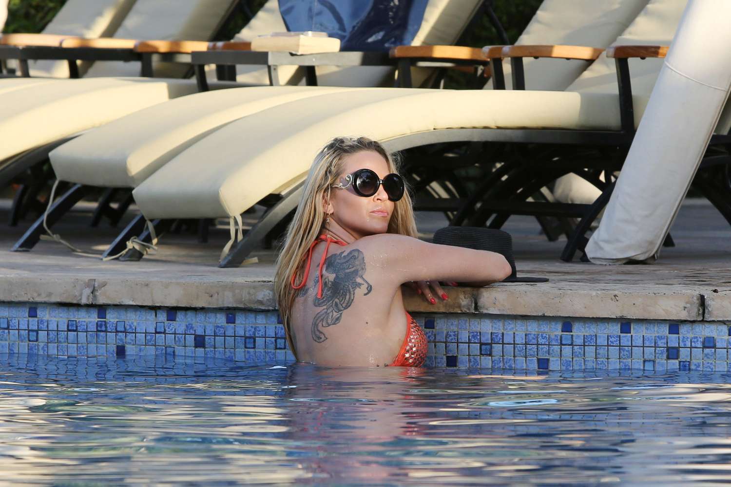 Sarah Harding in Bikini at a pool in Dubai. 