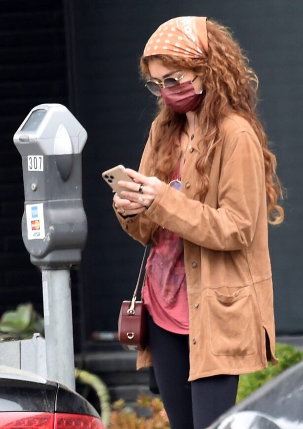 Sarah Hyland - feeds the parking meter in West Hollywood