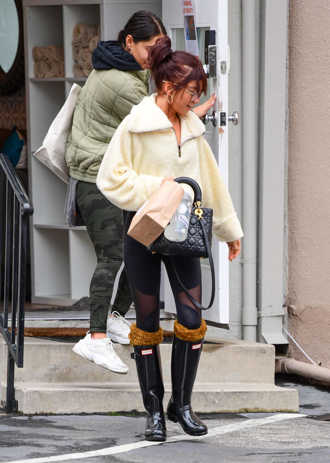 Sarah Hyland in Black Tights and Hunter Wellies Boots - Out and about in Lo...
