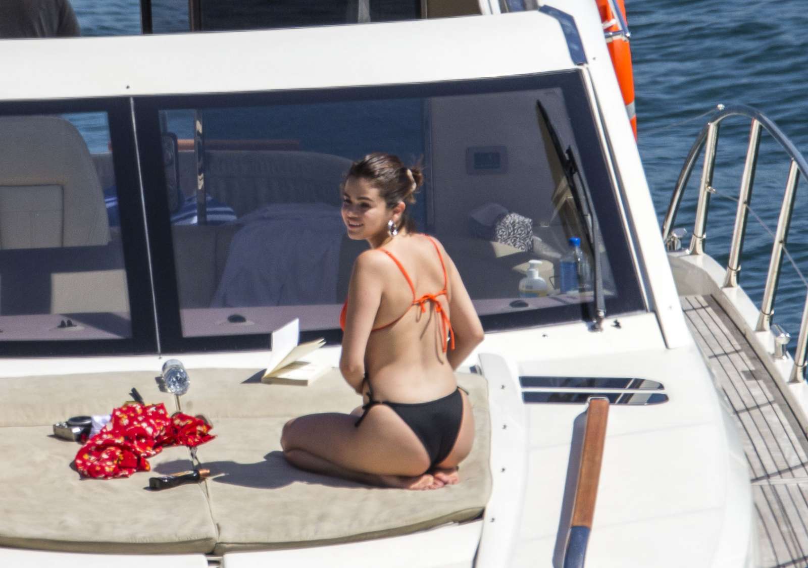 Selena Gomez in Black and Orange Bikini on a luxury boat in Sydney Harbour....
