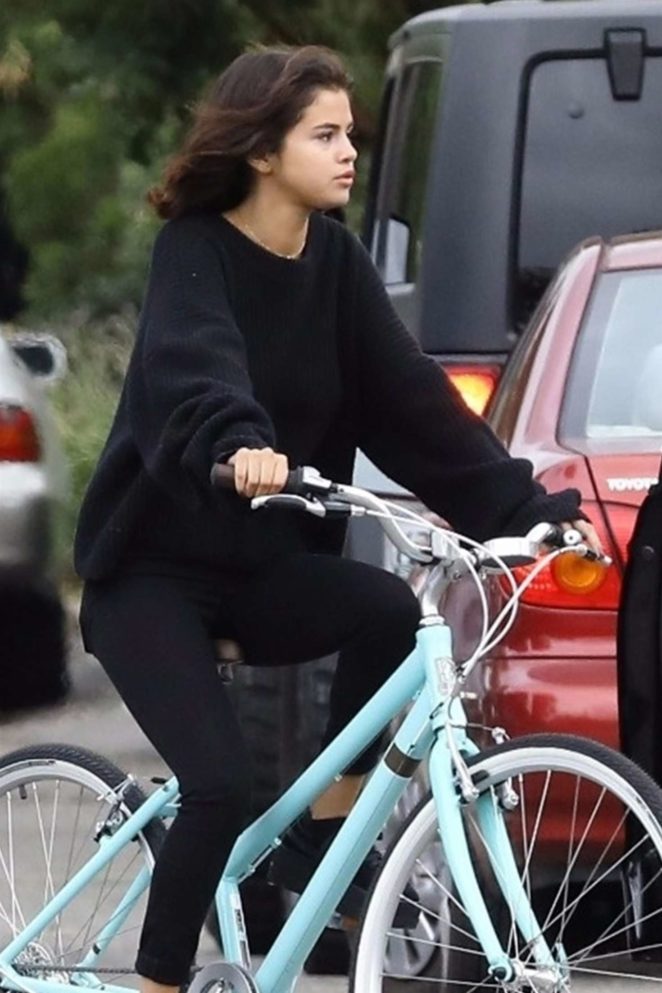 Selena Gomez in Black - Riding a bike in Los Angeles