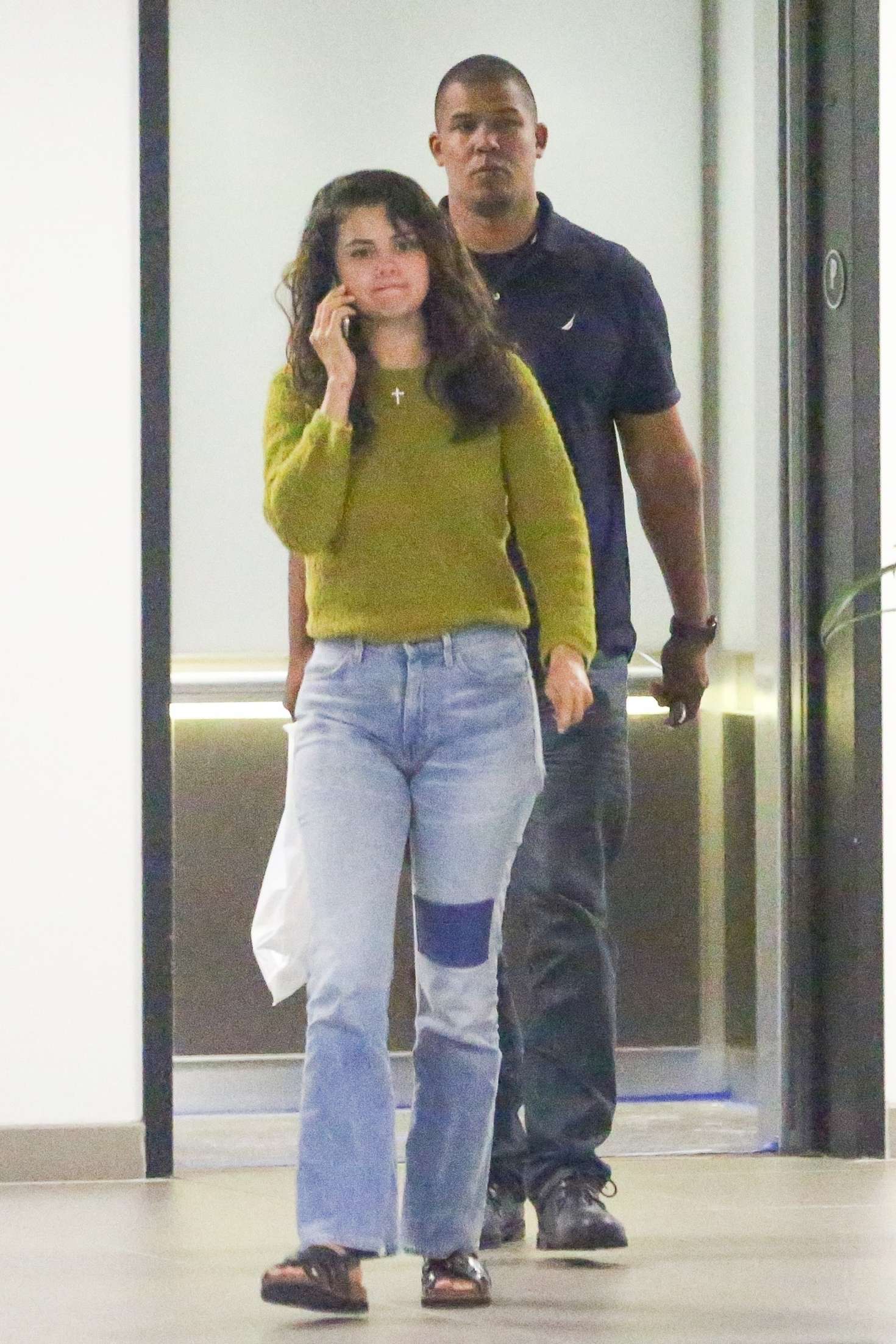 Selena Gomez in Jeans and Green Sweater - Out in Los Angeles