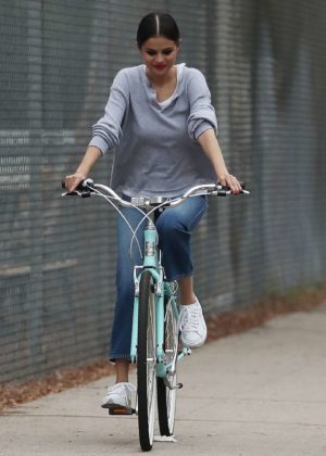Selena Gomez in Jeans riding her bike in LA