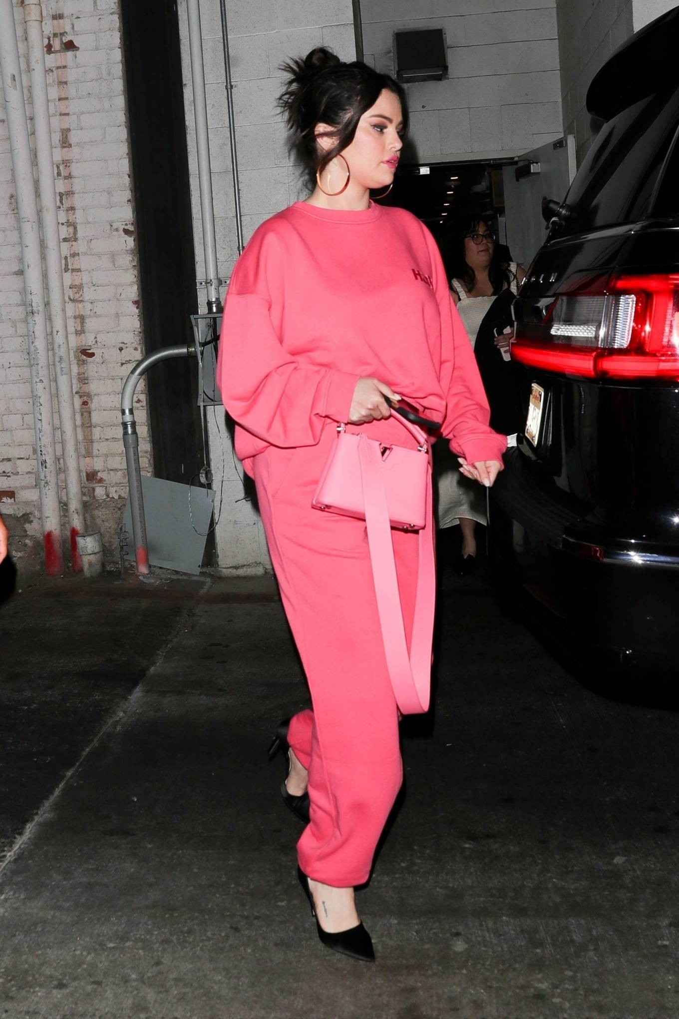 Selena Gomez - In pink as she leaves a late dinner at Wally's restaurant in Beverly Hills