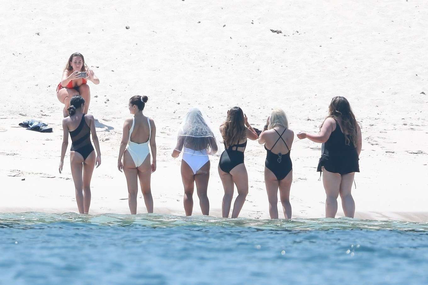 Selena Gomez 2019 : Selena Gomez in White Swimsuit Paddleboarding-06