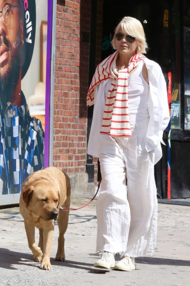Selma Blair - Rpcks all white attire as she cuddles her dog Scout in Manhattan’s SoHo