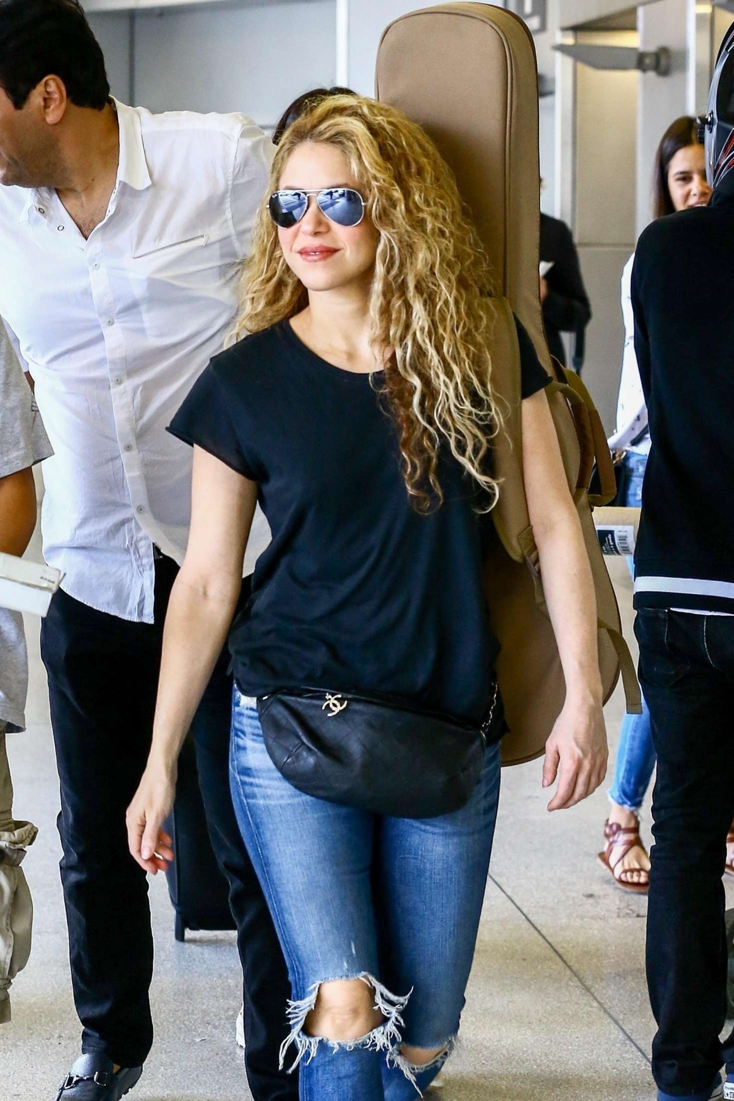 Shakira in Ripped Jeans at Airport in Miami
