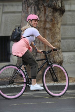 Sian Welby - riding trim bicycle in London