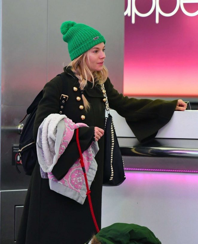 Sienna Miller at Heathrow Airport in London