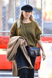 Sienna Miller in a green sweater in New York City