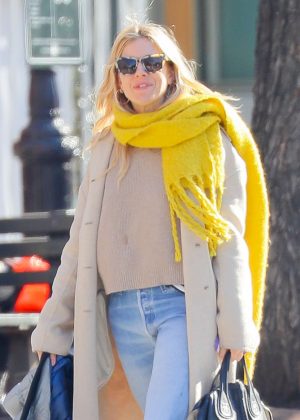Sienna Miller in a yellow scarf out in New York City