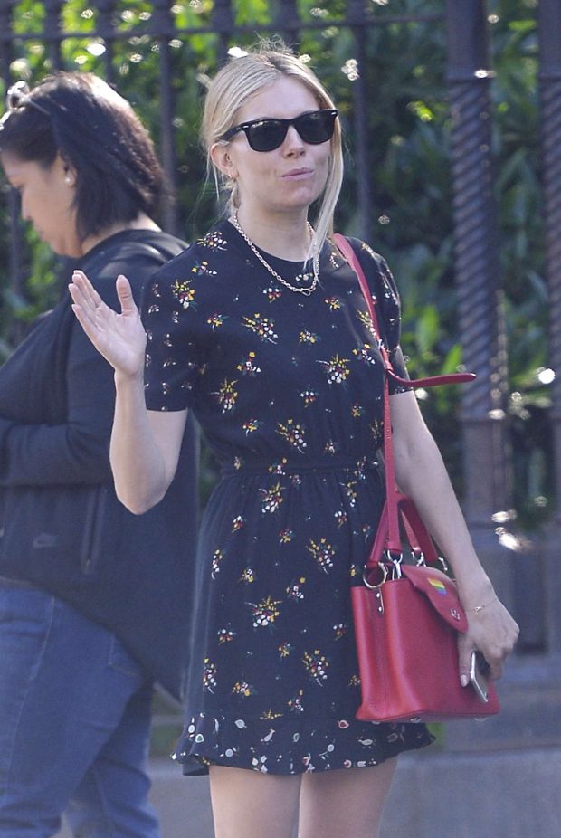 Sienna Miller - Wears a floral romper dress and fuschia shoulder bag in NYC