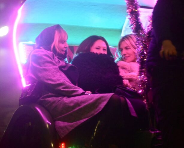Sienna Miller - With Fran Cutler on a rickshaw going up Park Lane in London
