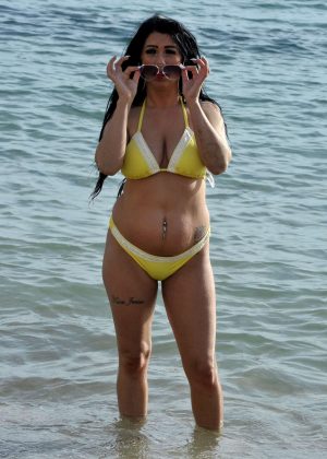 Simone Reed in Yellow Bikini on the beach in Spain