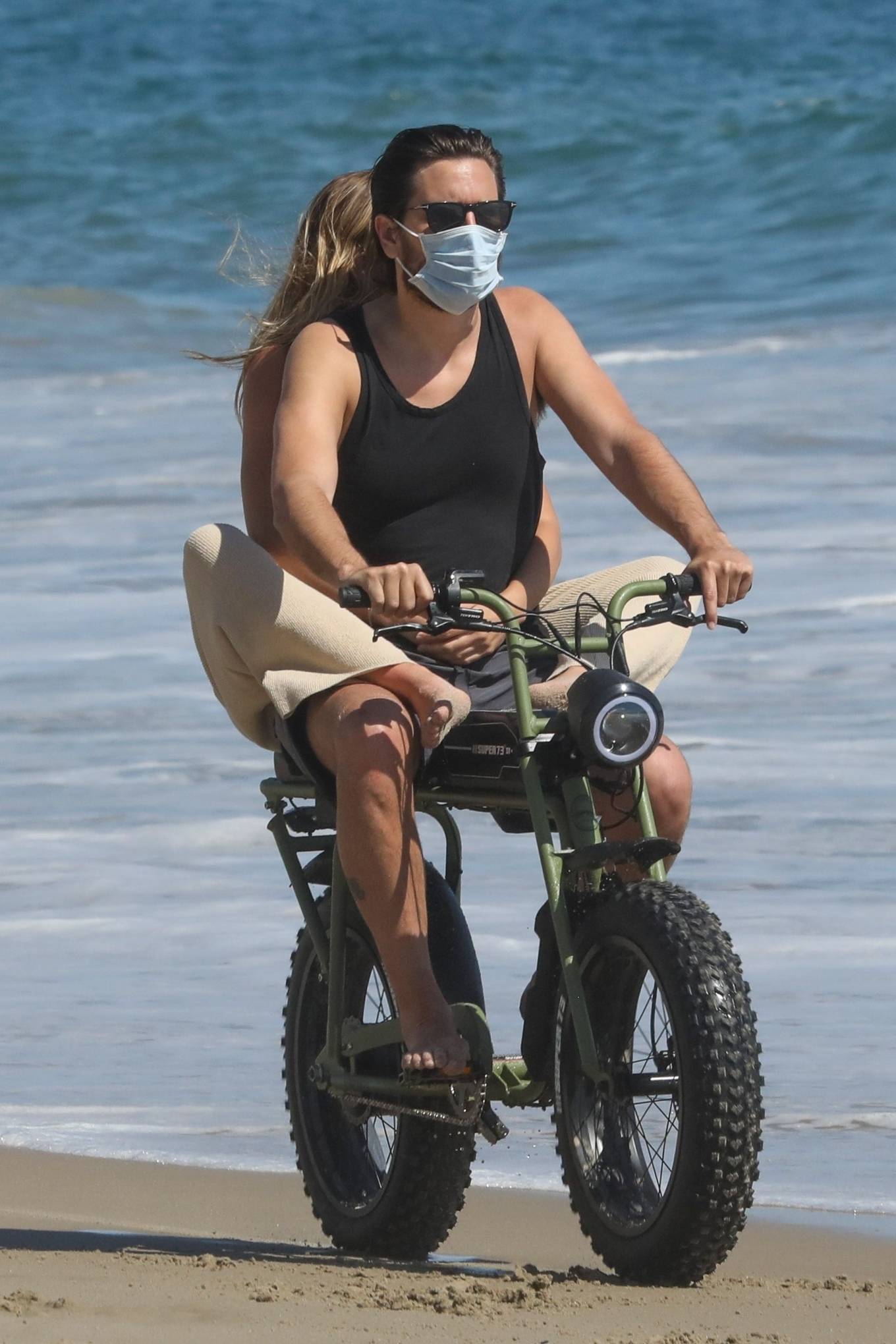Sofia Richie and Scott Disick have some fun riding a motorbike in Malibu