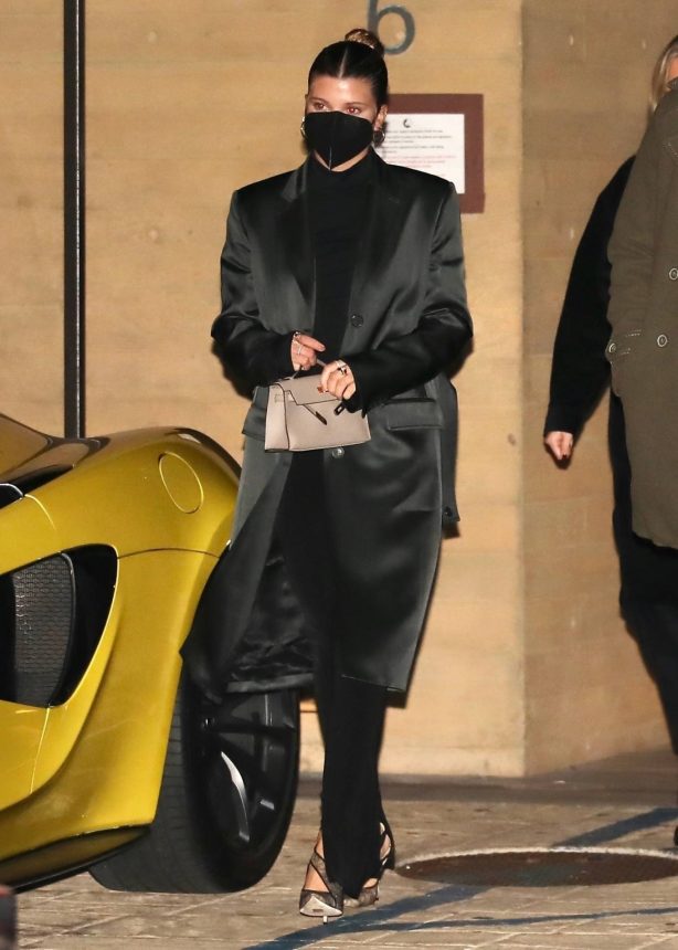 Sofia Richie - In a all black trench coat, turtleneck and wide leg pants at Nobu in Malibu