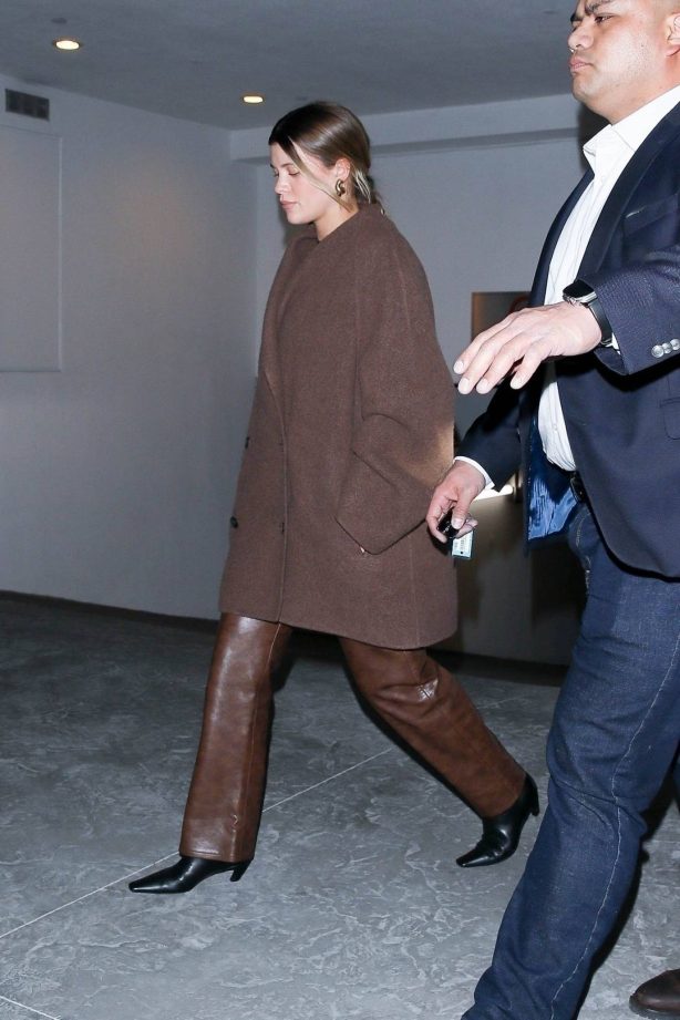 Sofia Richie - Wearing a large coat to dinner with friends in Beverly Hills