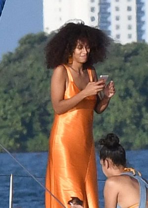 Solange Knowles in Orange Dress on a sailboat in Miami