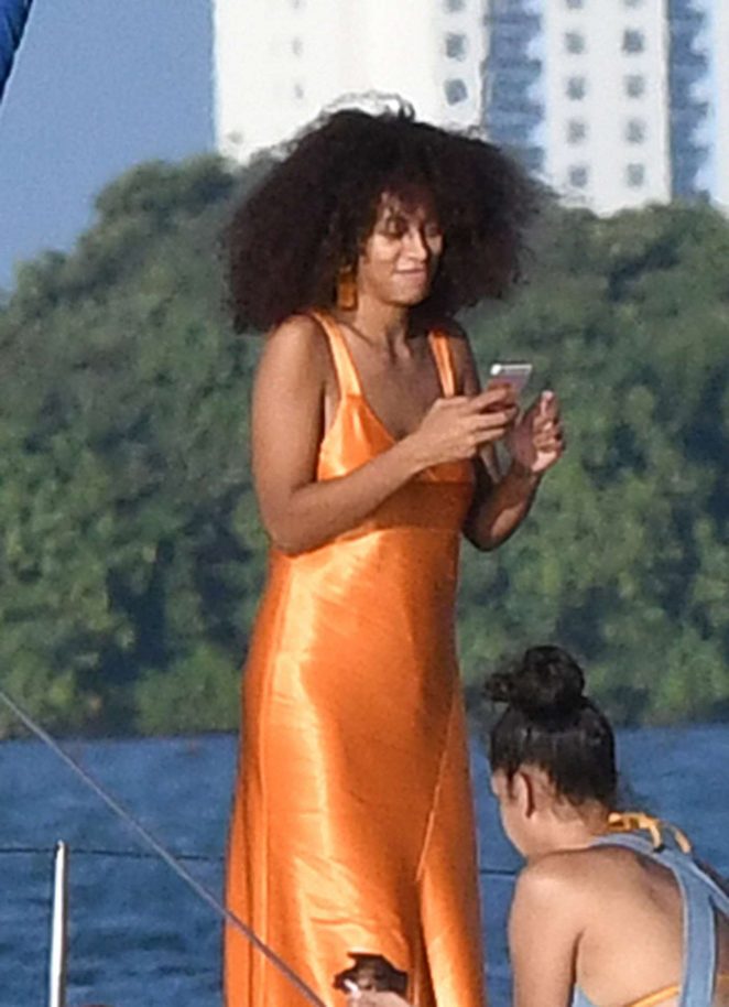 Solange Knowles in Orange Dress on a sailboat in Miami