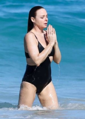 Stella McCartney in Black Swimsuit on the beach in St Barth