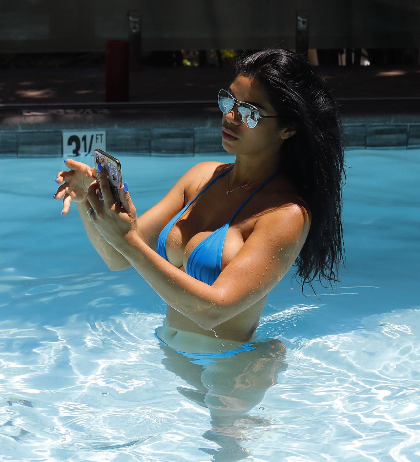 Suelyn Medeiros in Blue Bikini at luxury hotel in Los Angeles. 