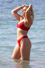 Tallia Storm in Red Bikini on the beach in Ibiza