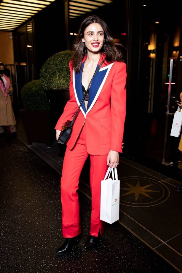 Taylor Hill - In a red suit exits the Bulgari Hotel during fashion week in Paris