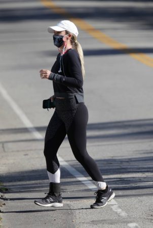 Teddi Mellencamp - In black leggings jog with a friend in Los Angeles