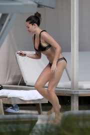 Thylane Blondeau in Black Bikini on the pool in Miami