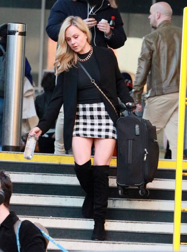 Tina O'Brien - In mini skirt arriving at Euston Train Station in London