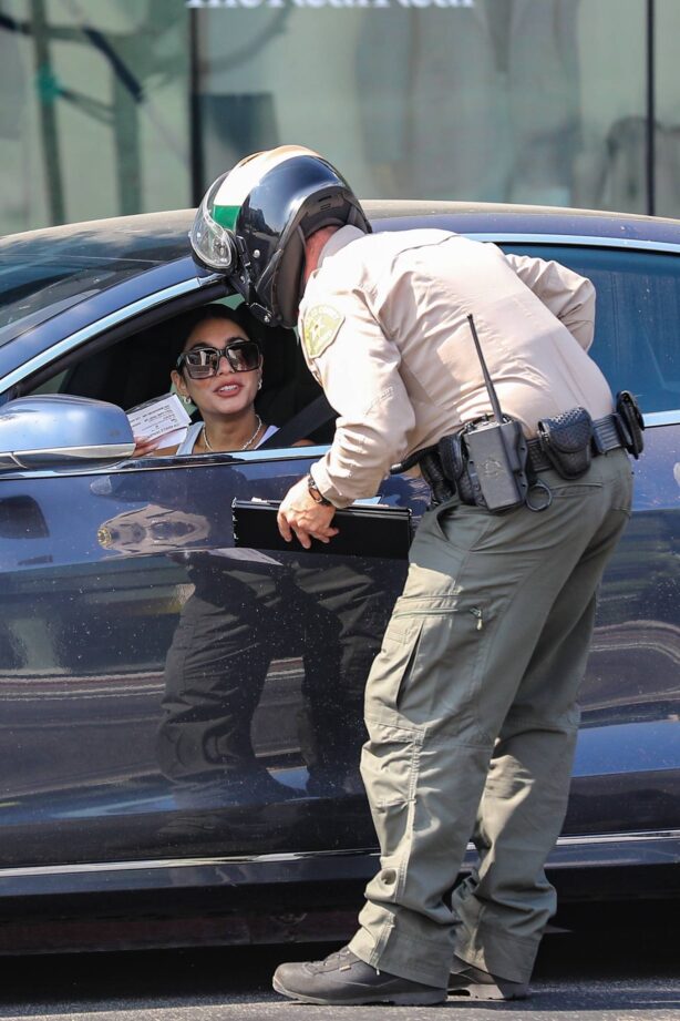 Vanessa Hudgens - Got ticket for using her phone while driving in West Hollywood