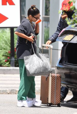 Vanessa Hudgens - Seen with Louis Vuitton luggage in New York City