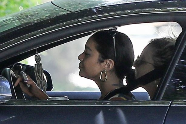 Vanessa Hudgens - Spotted in her car while cruising with a friend in Hollywood