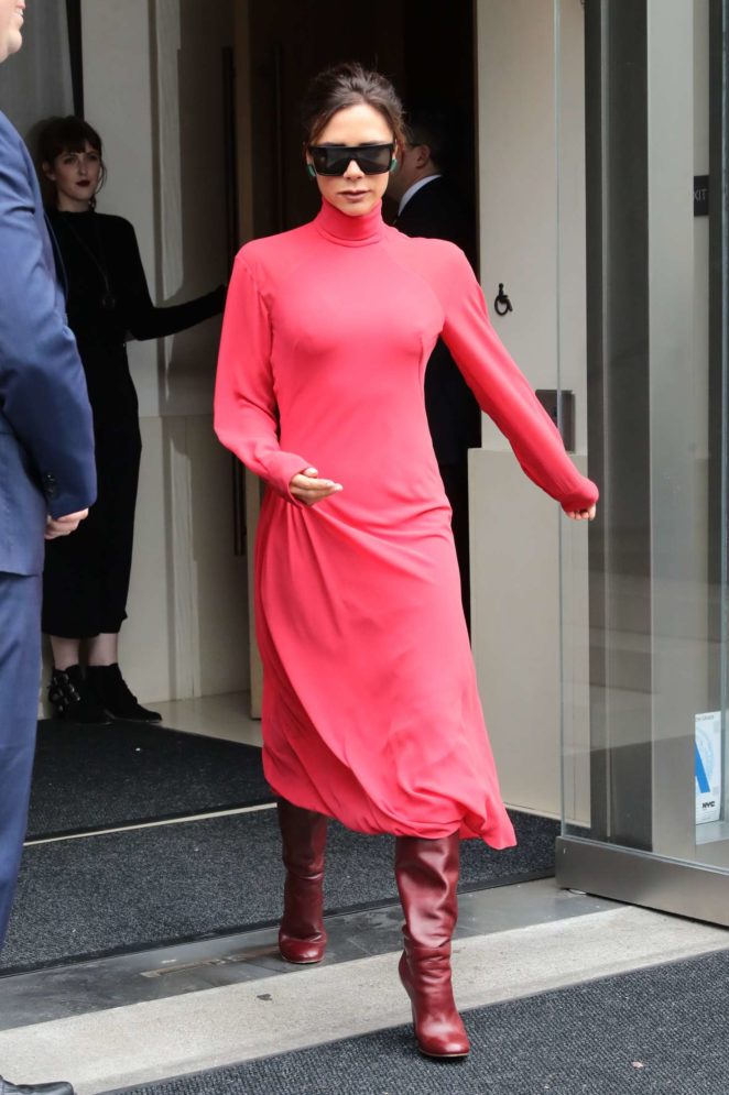 Victoria Beckham in red as she leaves her hotel in New York