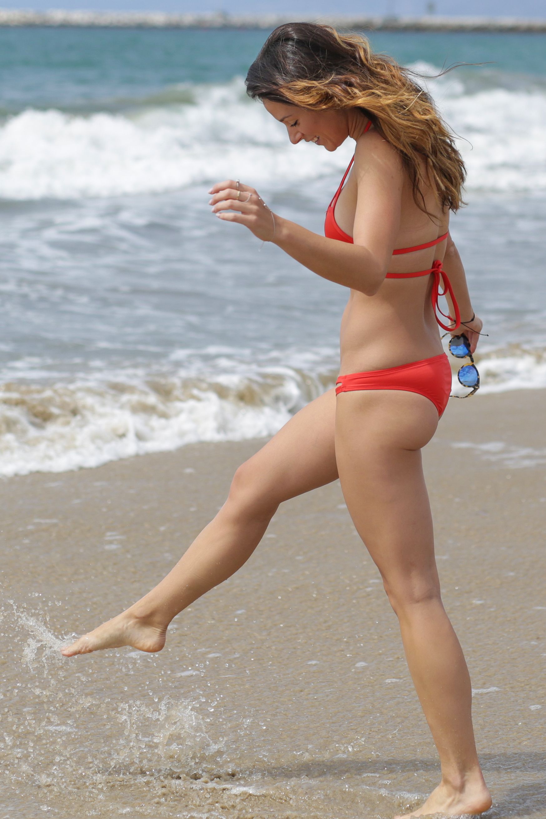 Victoria Brown in Red Bikini on the beach in Los Angeles. 