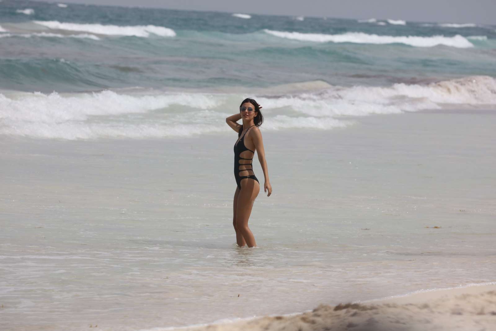 Victoria Justice in Swimsuit at a beach in Cancun. 