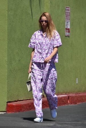 Whitney Port - wearing a lavender floral print outfit and matching sunglasses