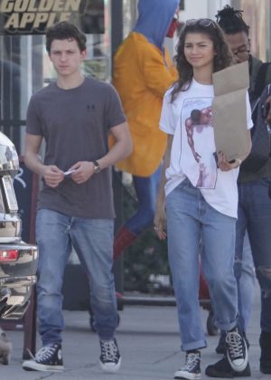 Zendaya and Tom Holland - Pose with a Spiderman statue at a comic store in LA