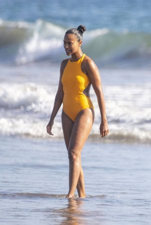 Zoe Saldana - In bikini on the beach in Malibu