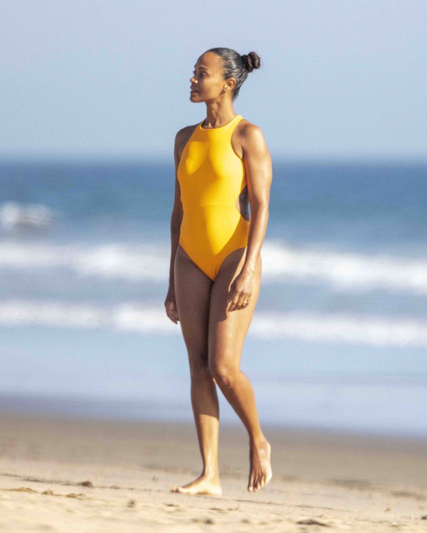 Zoe Saldana - In bikini on the beach in Malibu. 