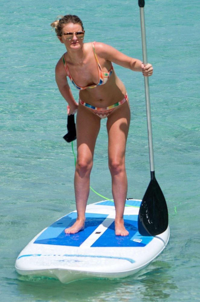Zoe Salmon in Bikini Paddle boarding on the beach in Barbados