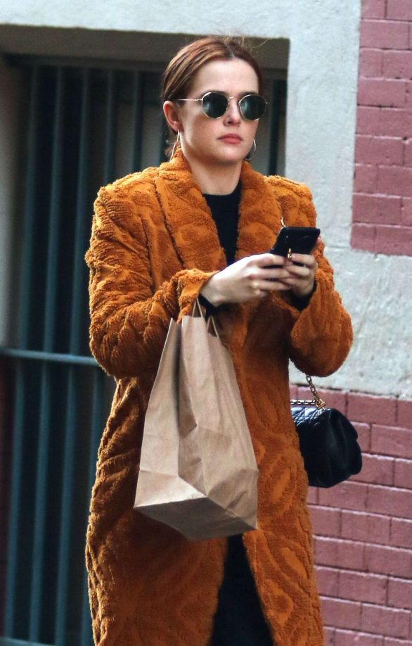 Zoey Deutch in a bathrobe style jacket shopping in Manhattan
